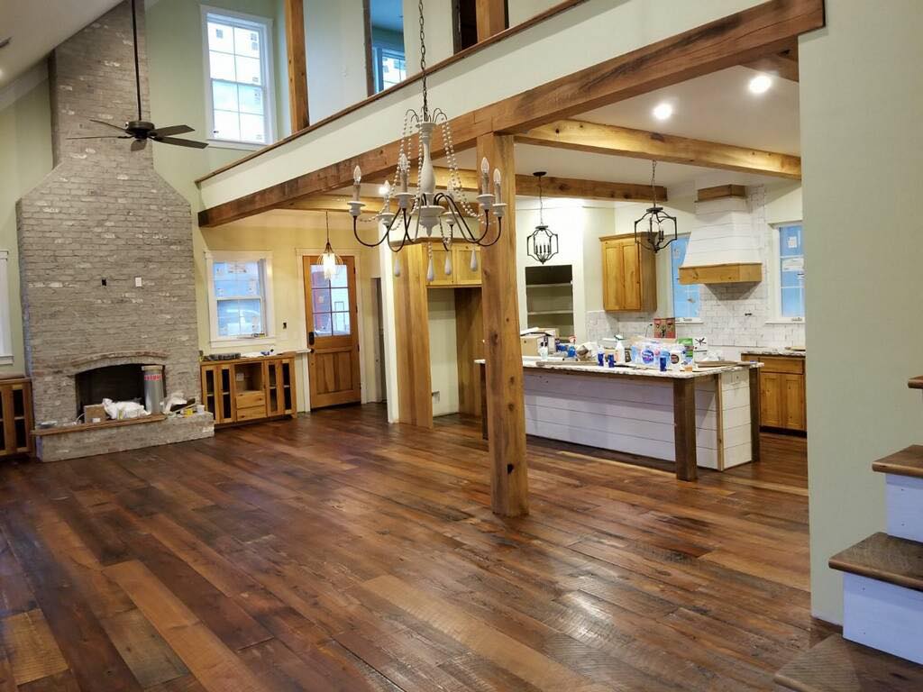 Indoor living area with Hardwood Flooring and chandelier
